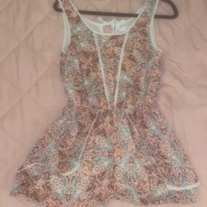 Zoe & Rose colorful romper with a second layer underneath .